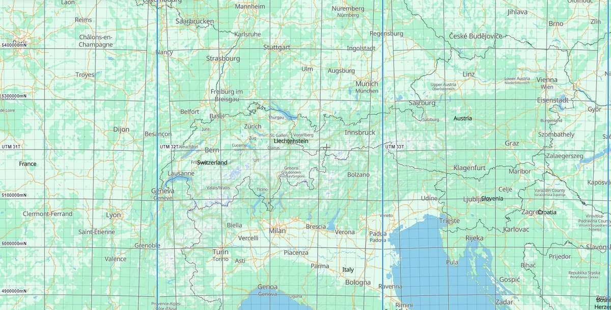 The UTM grid over the Alps, with blue zone boundaries, zone tags UTM 31T, 32T and 33T, and northing labels such as 5300000mN along the edge